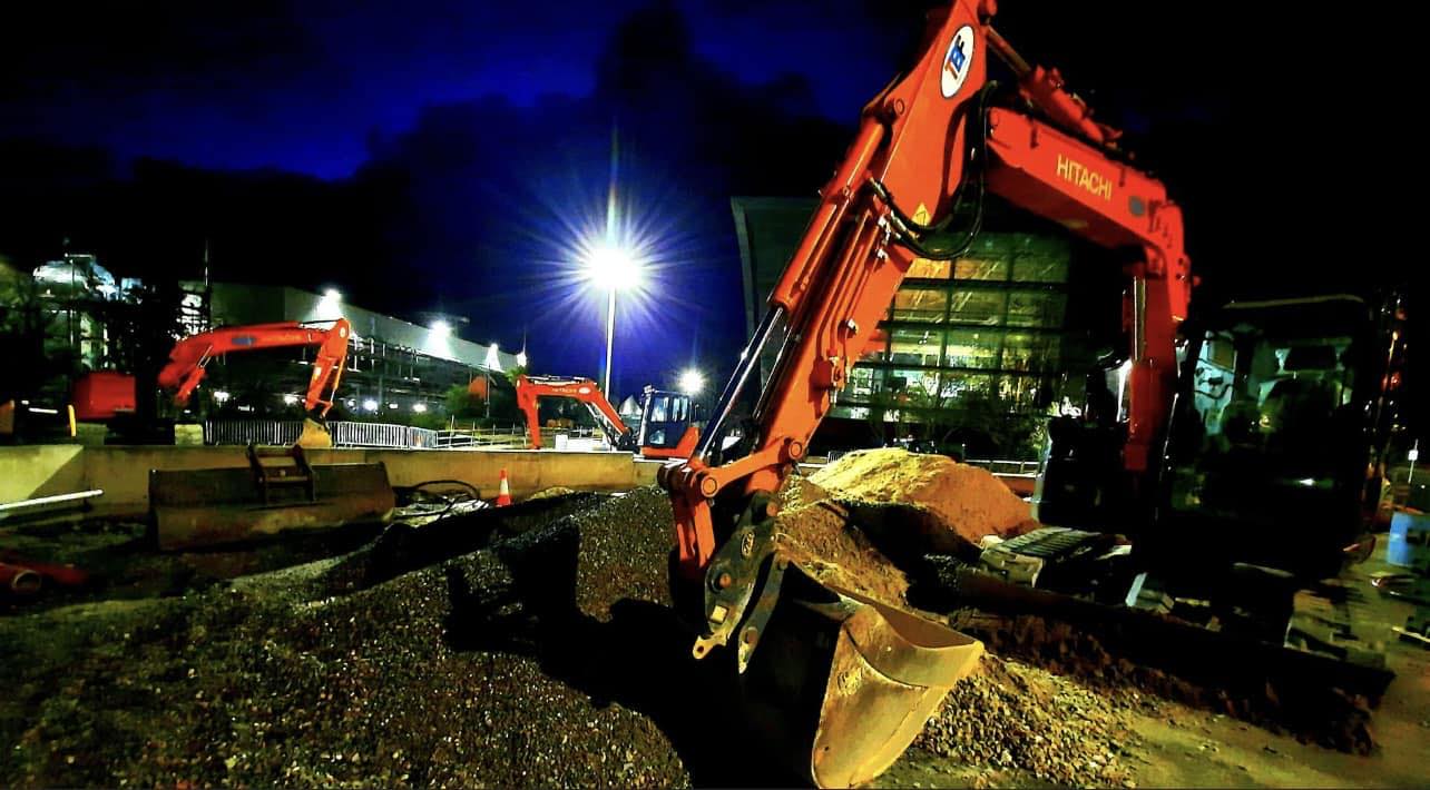 Hitachi excavators working at night